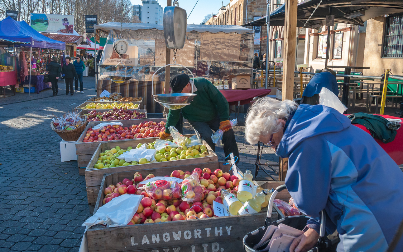 Local farmers selling produce at markets