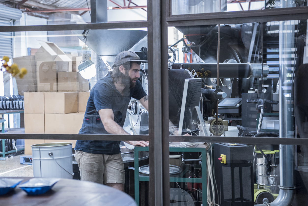 Man using computer in warehouse