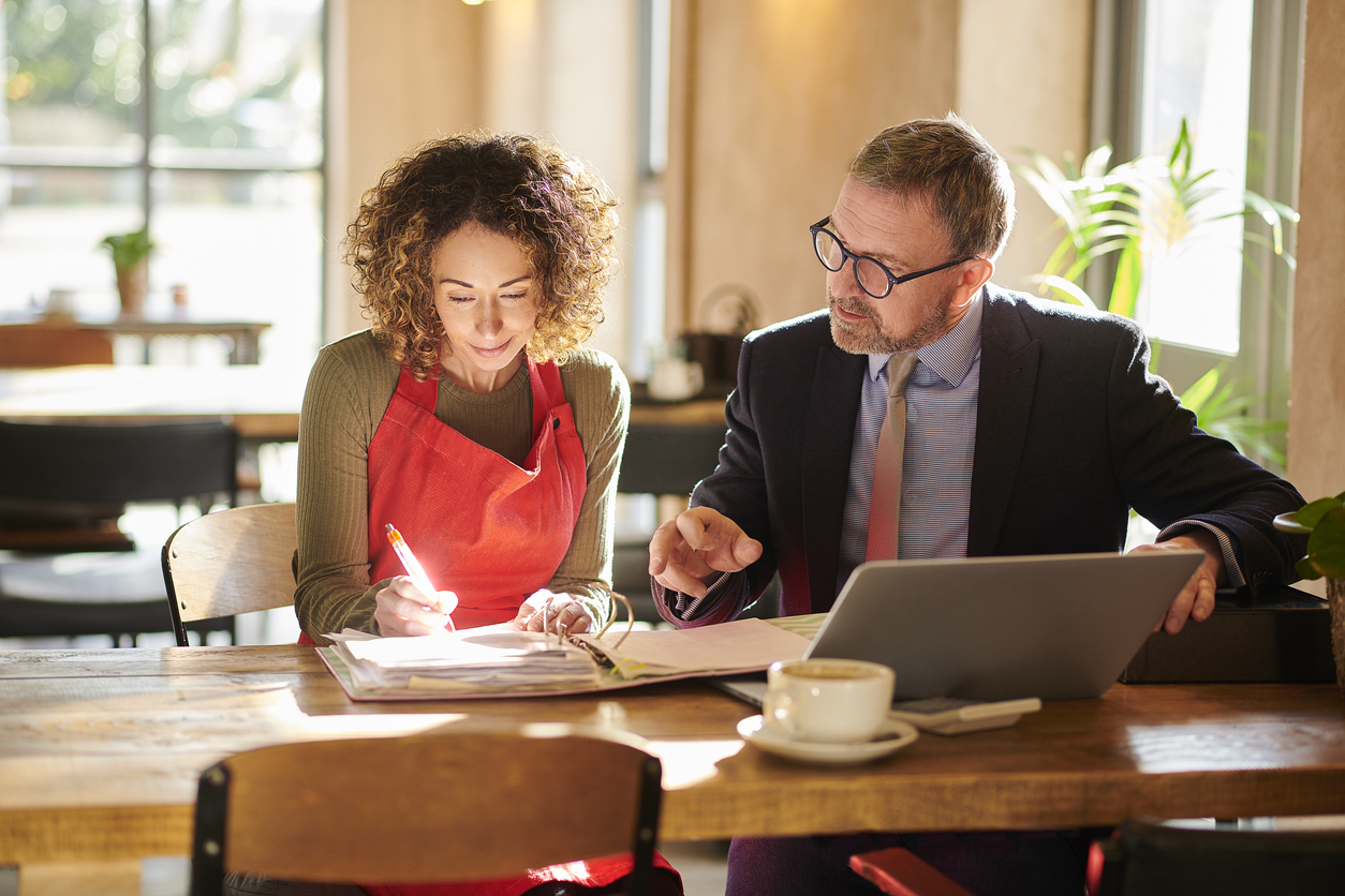 Woman and man going over paperwork together 