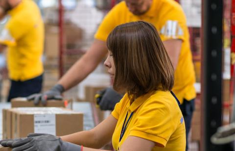 woman working on a delivery line