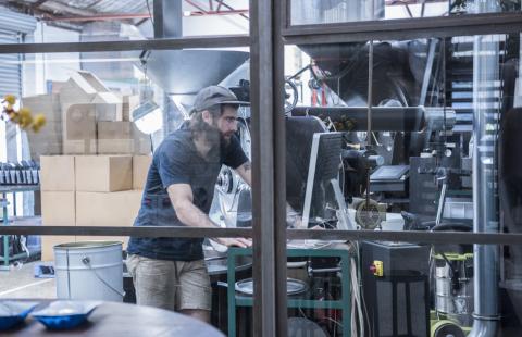 Man using computer in warehouse